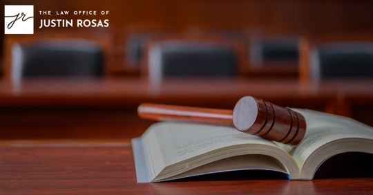gavel on an open book in a court room